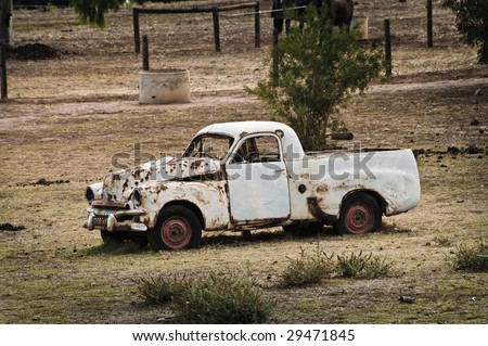 stock photo Old rusty car abandoned in the country