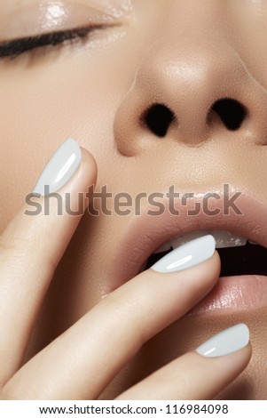 Make-up & cosmetics, manicure. Close-up portrait of beautiful woman model face with clean skin on white background. Natural skincare beauty, clean soft skin, manicure