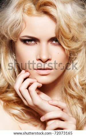  Attractive woman model with shiny blond long hair fashion makeup