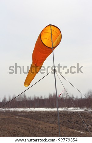 Wind direction Flag on blue cloud sky in  wind