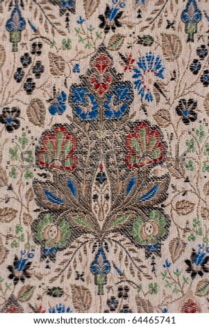 A close up view of vintage Chinese silk fabric.