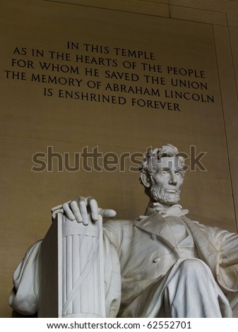 Inside the Lincoln Memorial with engraving behind Lincoln.