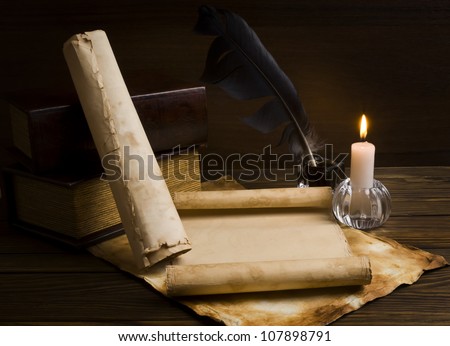 old papers and books on a wooden table