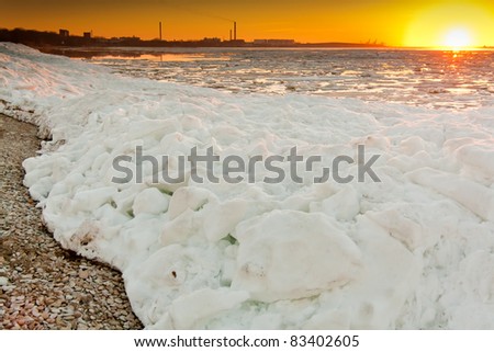 Sunset at ice cold sea