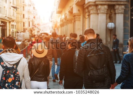 Unrecognizable mass of people walking in the street of the city