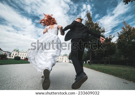 Wedding couple on a walk in the estate of the Belvedere in Vienna