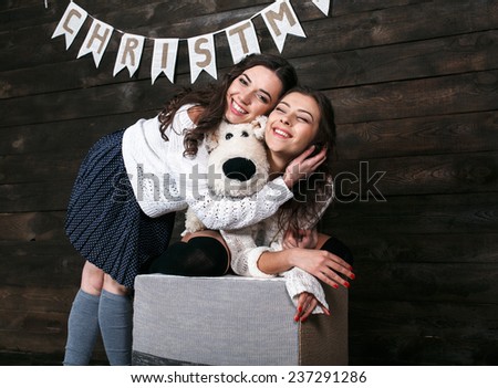 Family New Year's photos, one sister hugging each