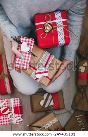 A lot of gifts on Valentine\'s Day in the hands of a girl