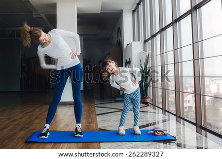 Charming family spends time in the gym