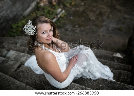 beautiful woman resting on the stone steps