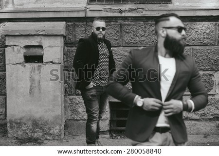Two stylish bearded men on the background of the old town