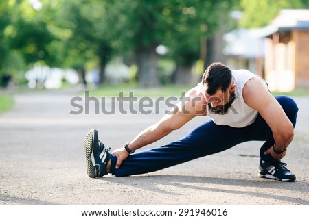 bearded man perform various exercises and stretches