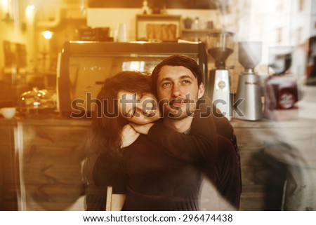 Vintage couple hugs and laughing .Coffee shop. instagram toned