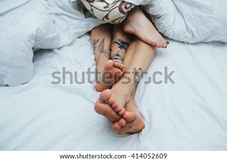beautiful couple lying together on the bed