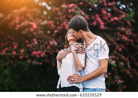 http://image.shutterstock.com/display_pic_with_logo/666661/633250529/stock-photo-young-happy-couple-in-love-outdoors-loving-man-and-woman-on-a-walk-in-a-spring-blooming-park-633250529.jpg