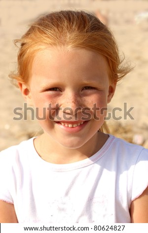 stock photo Portrait of a redhaired naughty girls at the age of 5
