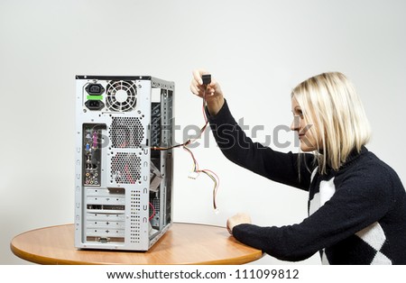 girl repairing the system unit