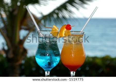 2 colourful cocktails waiting to be drunk