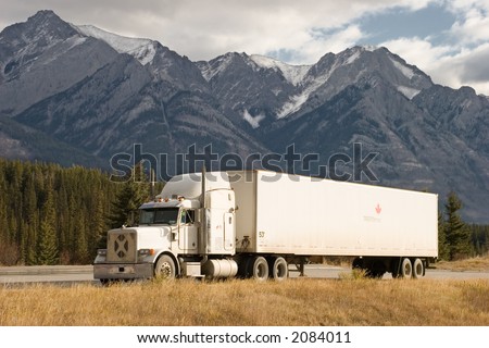 a truck stops in a rest area in the Canadian Rockies