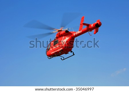ROMFORD, ESSEX - AUG 9: A Virgin air ambulance takes off after attending to a patient and taken to hospital August 9, 2009, in Romford, Essex, England.