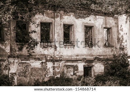 Halloween concept. Ruins of old abandoned empty house in forest