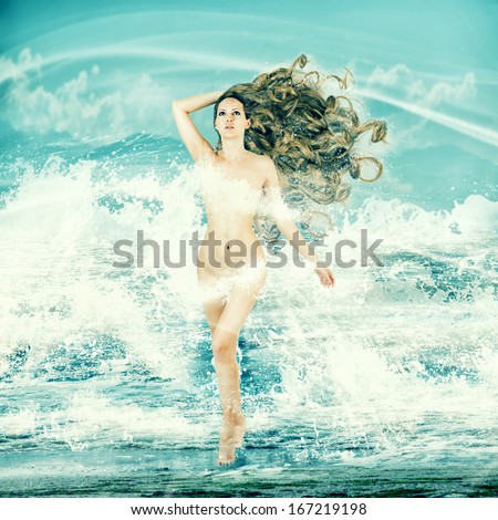 Sexy fairy slim woman with long curly hair - Aphrodite is in sea water in a spray of sea waves