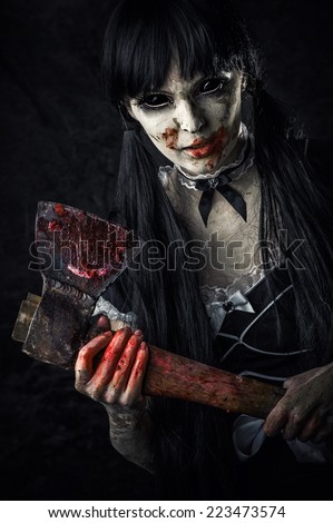 Dead female zombie with bloody axe. Halloween horror. Evil ghost with black eyes