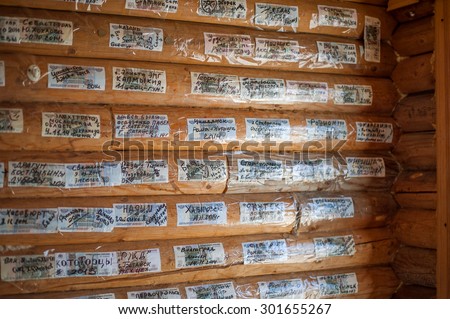 CHEGET, RUSSIA - July 05: Inside interior of cafe and snack-bar on top of Mount Cheget - 3050m. Walls are plastered money with signatures from travelers and climbers in July 05, 2015 in Cheget