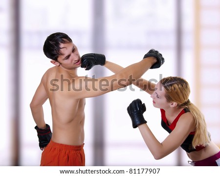 Fight of young couple. Mixed martial art