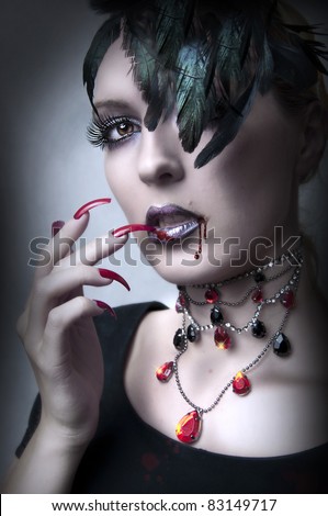Fashion portrait of Lady vamp - vampire gothic make-up style for Halloween