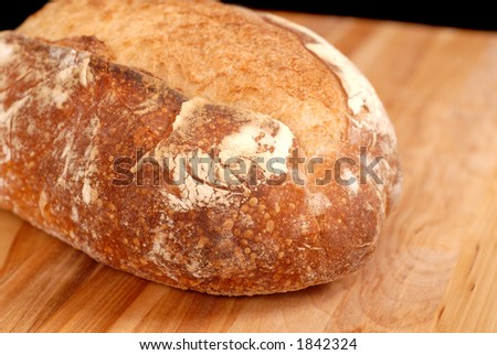 Large Italian bread loaf on cutting board