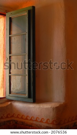 Warm light washes in an open window in the Mission of Santa Barbara