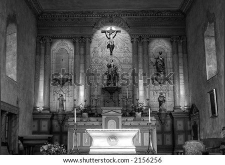 Black and white image of an 18th Century Mission Church awash with glowing light