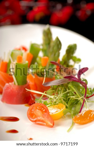 Plate of japanese sashimi with a micro green salad