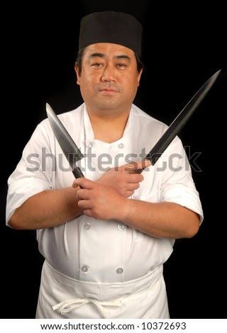 Male Japanese sushi chef posing with knives