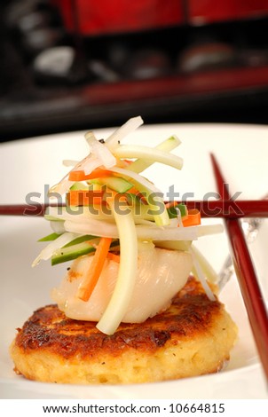 Asian crab cake and scallop appetizer with vegetables