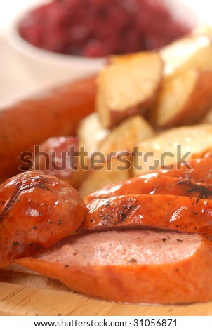 Grilled smoked sausage with potatoes and red cabbage