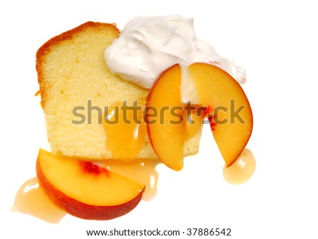 Freshly baked pound cake with whipped cream and peaches