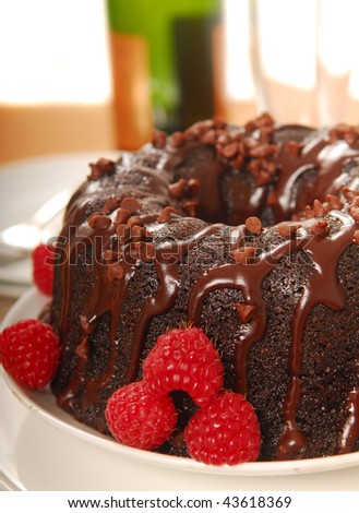 Chocolate fudge cake with raspberries and Champagne served in a romantic holiday setting