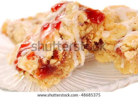 Strawberry pecan streusel coffee cake bars with vanilla icing