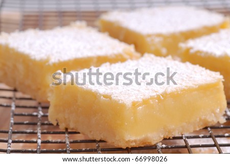 Delicious freshly baked lemon squares cooling on a wire rack