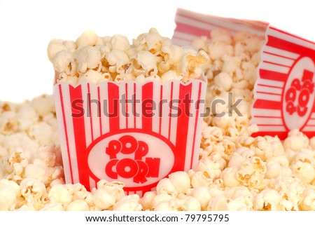 Two boxes of delicious movie popcorn with popcorn spilling out