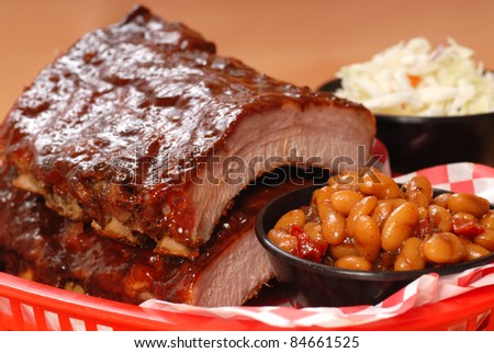 Delicious BBQ ribs with beans, cole slaw and a tangy BBQ sauce
