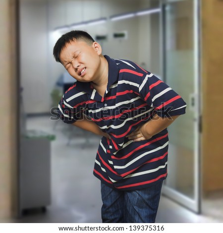 Young asian boy with an abdominal pain