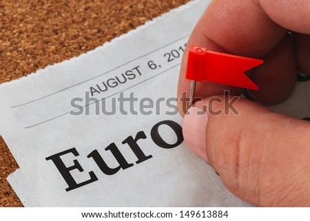 Plastic flag pin on a printed paper