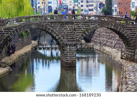 NAGASAKI, JAPAN - NOVEMBER 14: Megane Bridge in Nagasaki, Japan on November 14, 2013. Built in 1634 by Japanese monk Mokusu of Kofukuji. It is said to be the oldest stone arch bridge in Japan