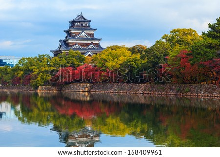 Hiroshima castle on the side of Otagawa river in autumn