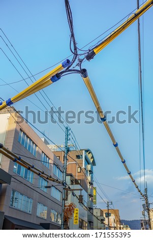 NARA, JAPAN - NOVEMBER 16: Electrical wiring in Nara, Japan on November 16, 2013. Special treated cover for electrical and telephone line wiring, protecting from weather at Sanjo dori street