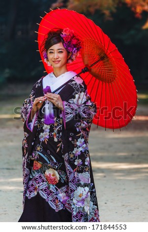 OKAYAMA, JAPAN - NOVEMBER 17: Japanese woman in Okayama, Japan on November 17, 2013. Unidentified female dresses Kimono for her wedding ceremony at Koraku-en garden