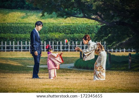 OKAYAMA, JAPAN - NOVEMBER 17: Shichi-go-san  in Okayama, Japan on November 17, 2013. Unidentified Japanese Family takes their daughter out to celebrate traditional rite of passage festival